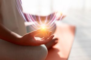 person meditating in lotus position